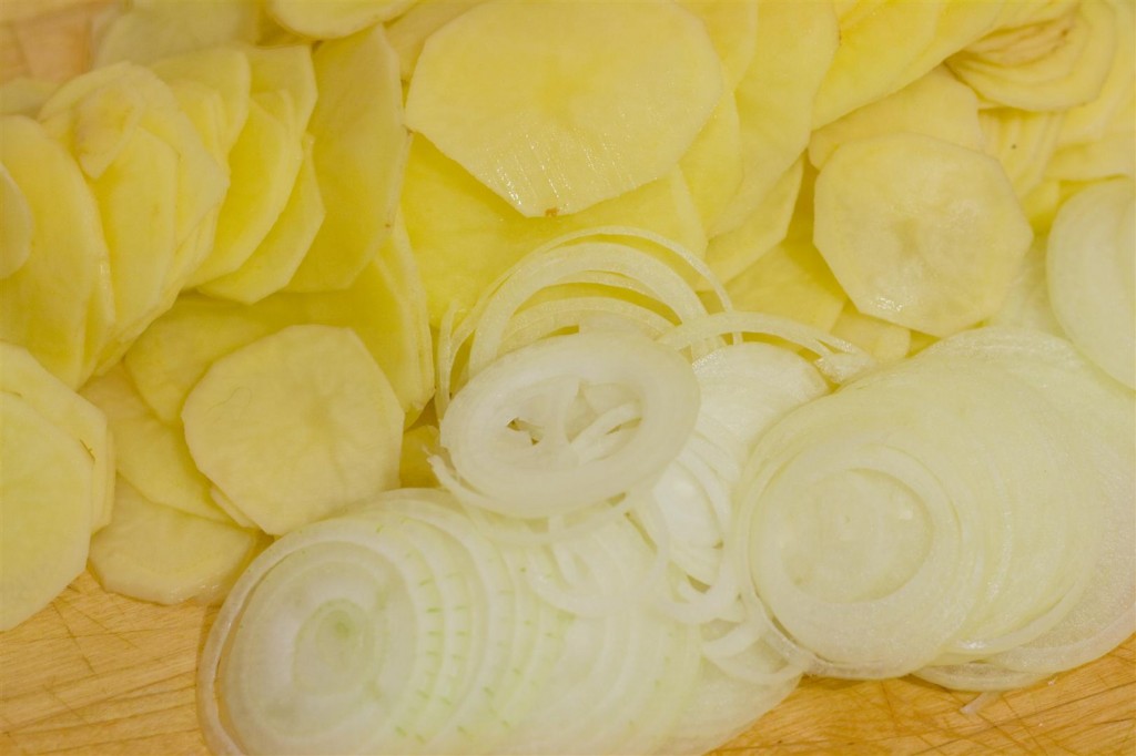 Chopping the onion and potato