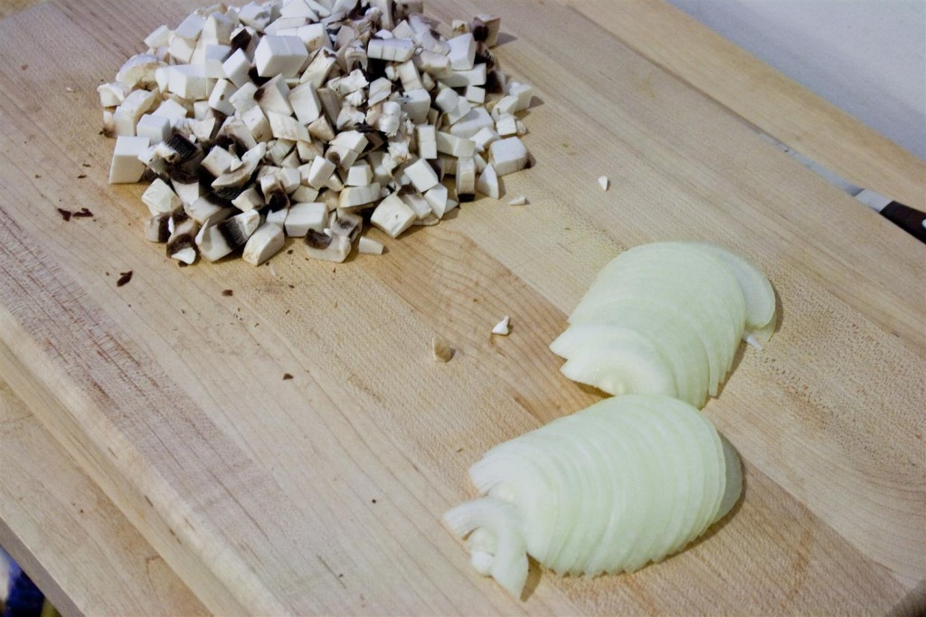 Chopping the mushrooms and onion