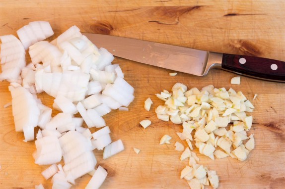 Chopping the onion and garlic
